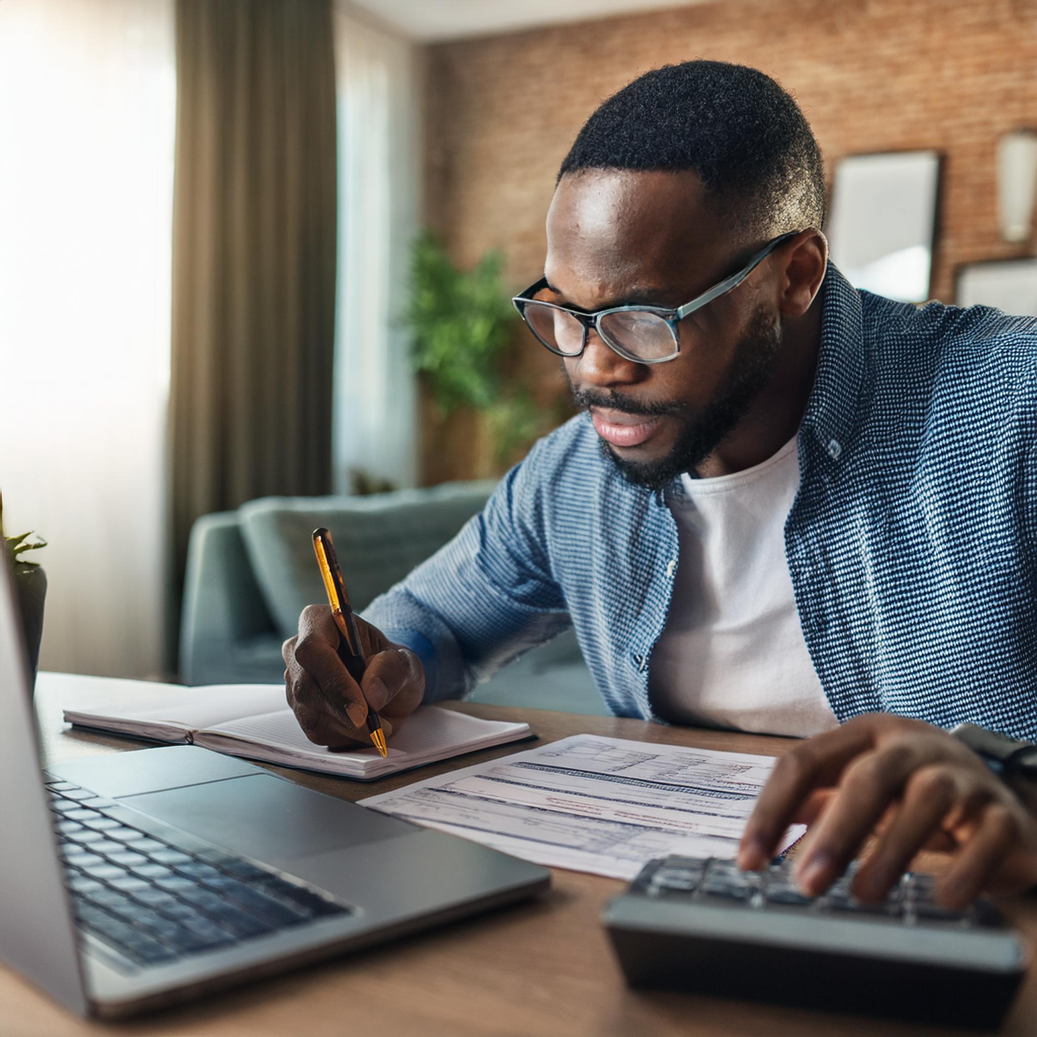 Firefly Photograph of a person sitting in front of his laptop, writing down his expenses; accounting